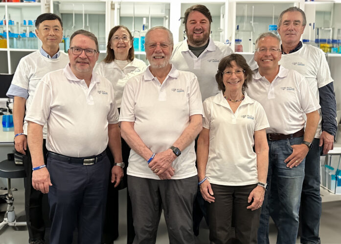 OMF researchers standing in a laboratory