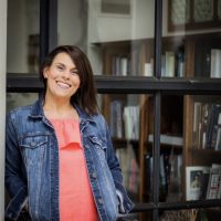 Woman smiling in a denim jacket